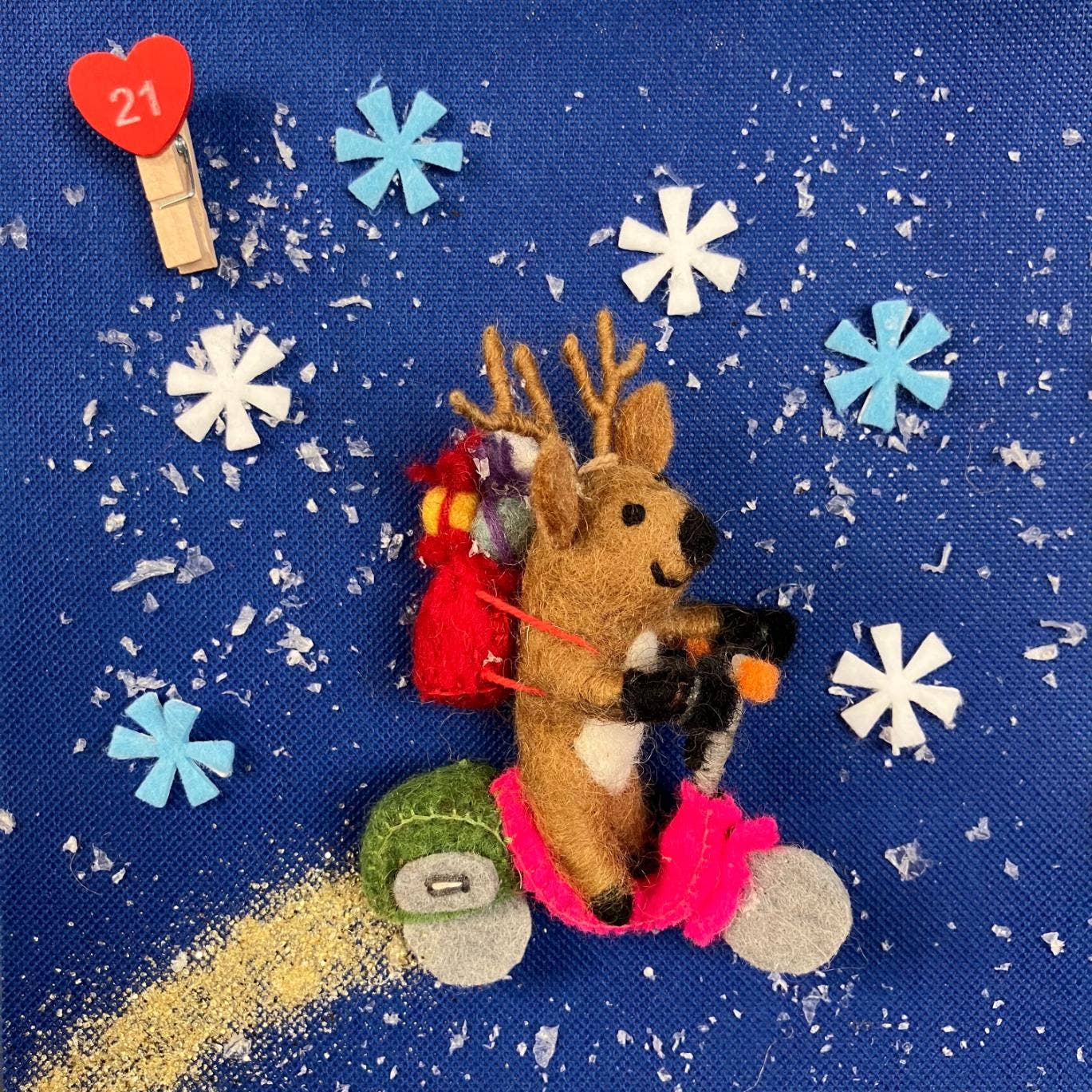 Handmade felt Comet the Reindeer Christmas decoration by Felt So Good, sustainable wool with adjustable wire antlers and red felted sack, fair trade and plastic-free