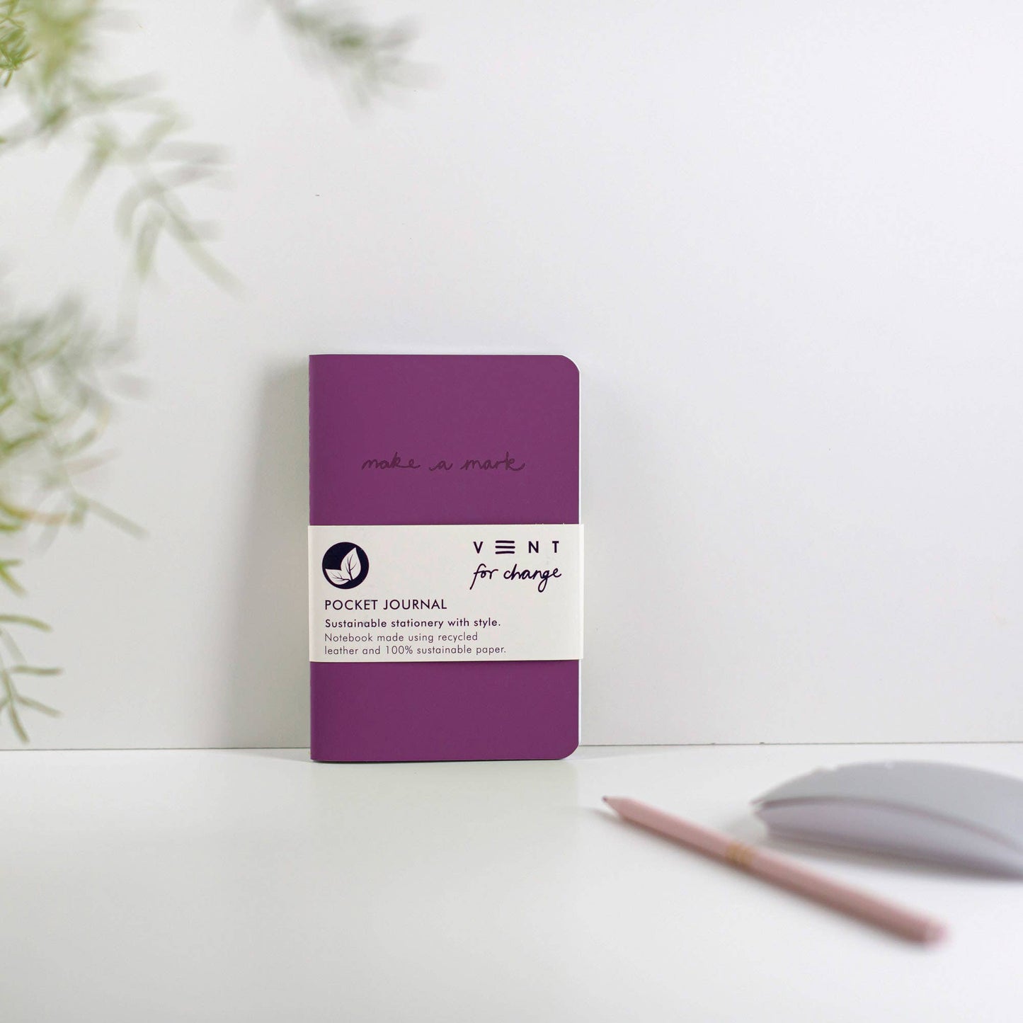 A6 recycled purple leather journal, open to show mixed lined and plain sustainably sourced paper