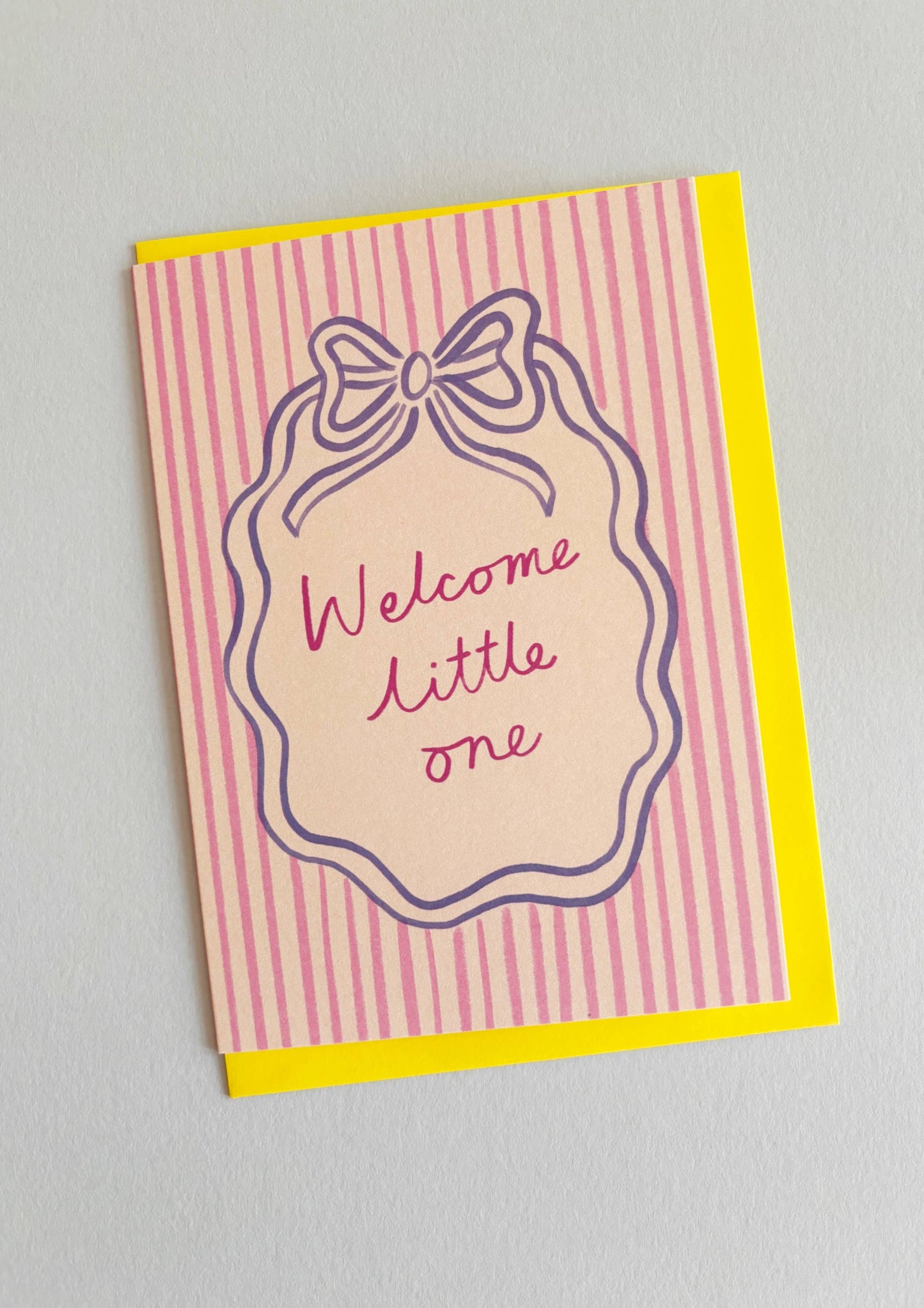 the newest star in town. The perfect way to say "Well hello there, little bundle of joy!" with a touch of royal flair! In blue and pink, with a yellow envelope. With the words Welcome Little One.
