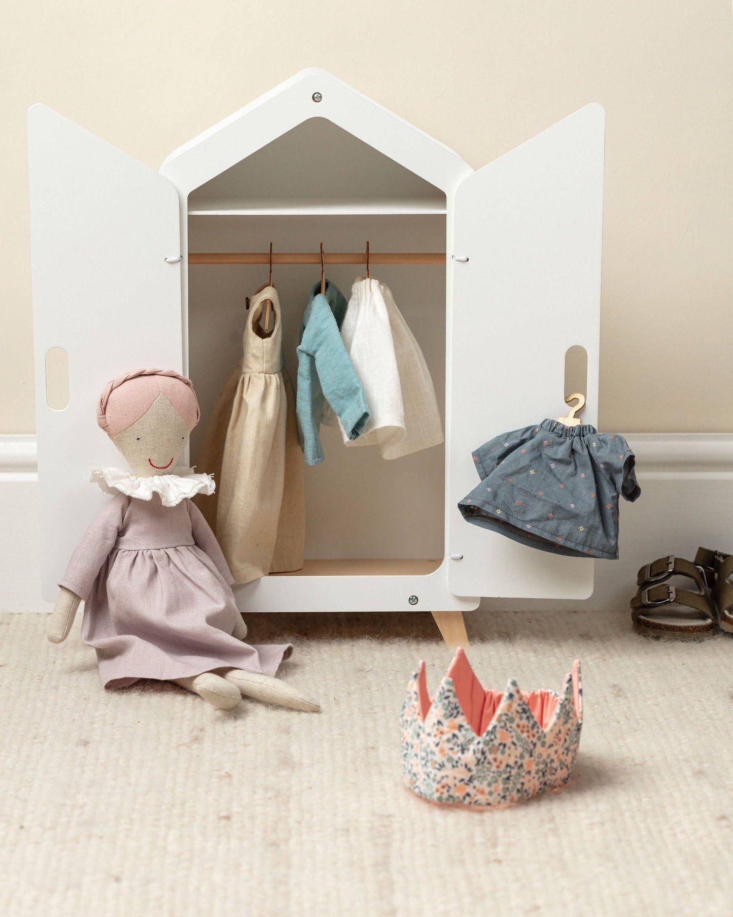 Daphne Dolly Pickles soft doll with a play wardrobe, showcasing her pink dress and pale red plaited hair.