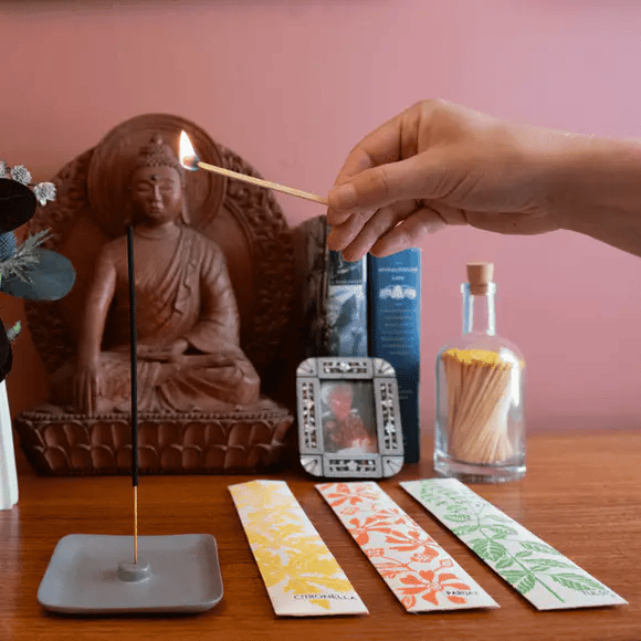 Luxury incense sticks in eco-friendly recycled paper packaging with botanical hand screen-printed design, handmade in India by disabled artisans.