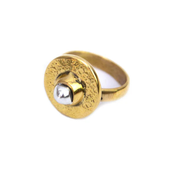 This Mombasa brass round ring is an elegant and striking signature piece. Ethically handmade in Kenya by our team of talented artisans. The brass is hand-hammered to give it a beautiful shimmer, making it an eye-catching accessory. The organic hammered texture and smooth aluminium ‘pearl’ makes this ring a wearable work of art.
Materials: Recycled Brass, Aluminium Pearl in the centre