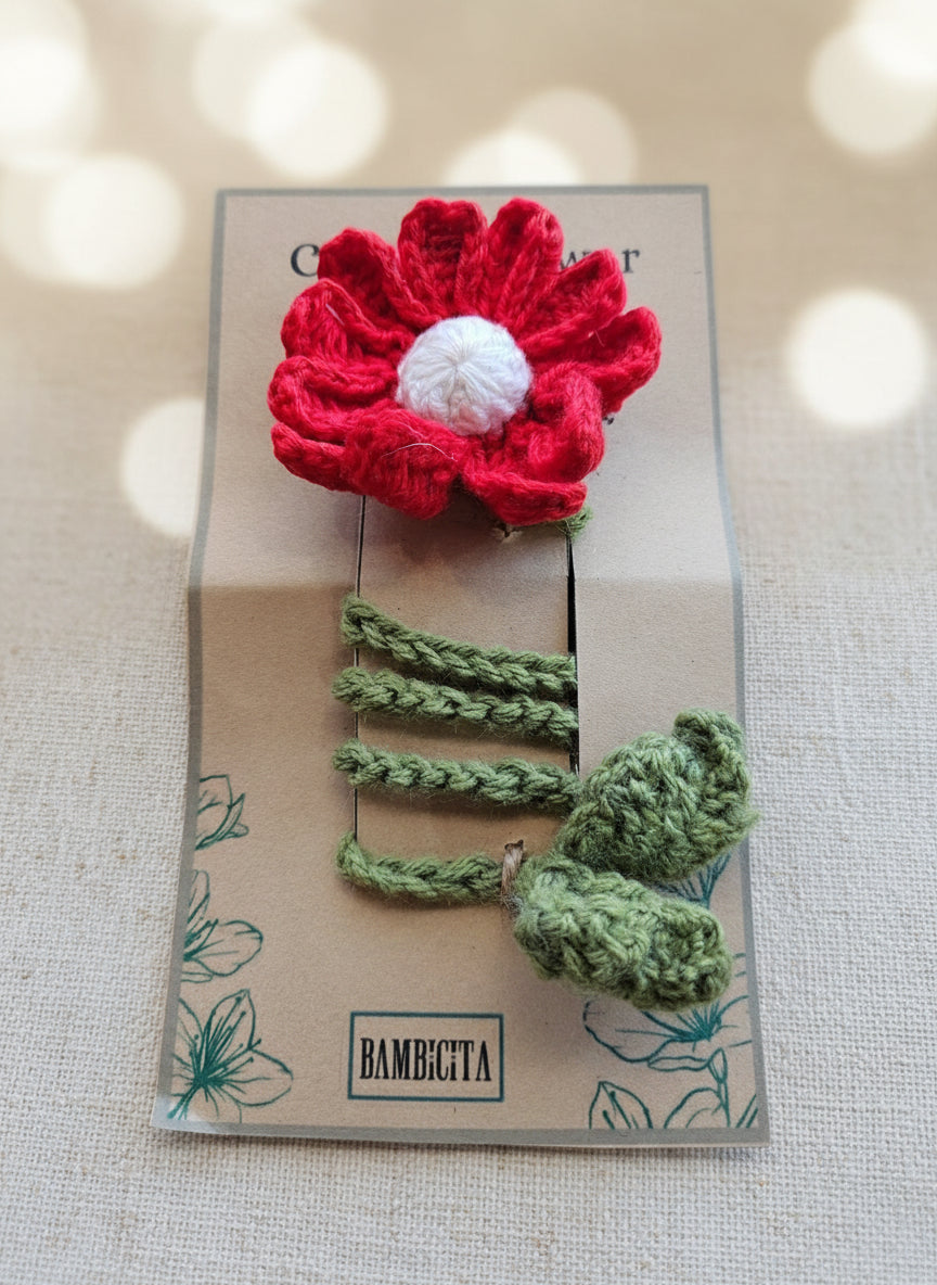 Handmade crochet flower bookmark on a book, showcasing detailed craftsmanship.