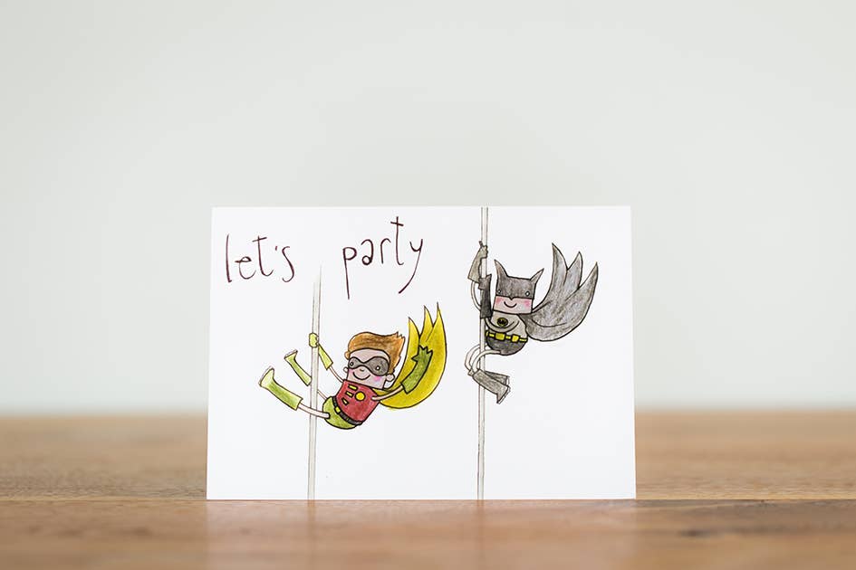 Let's Party on the front of the card. Time to party with batboy and Robbie in the batcave. For superhero and batman fans all over.