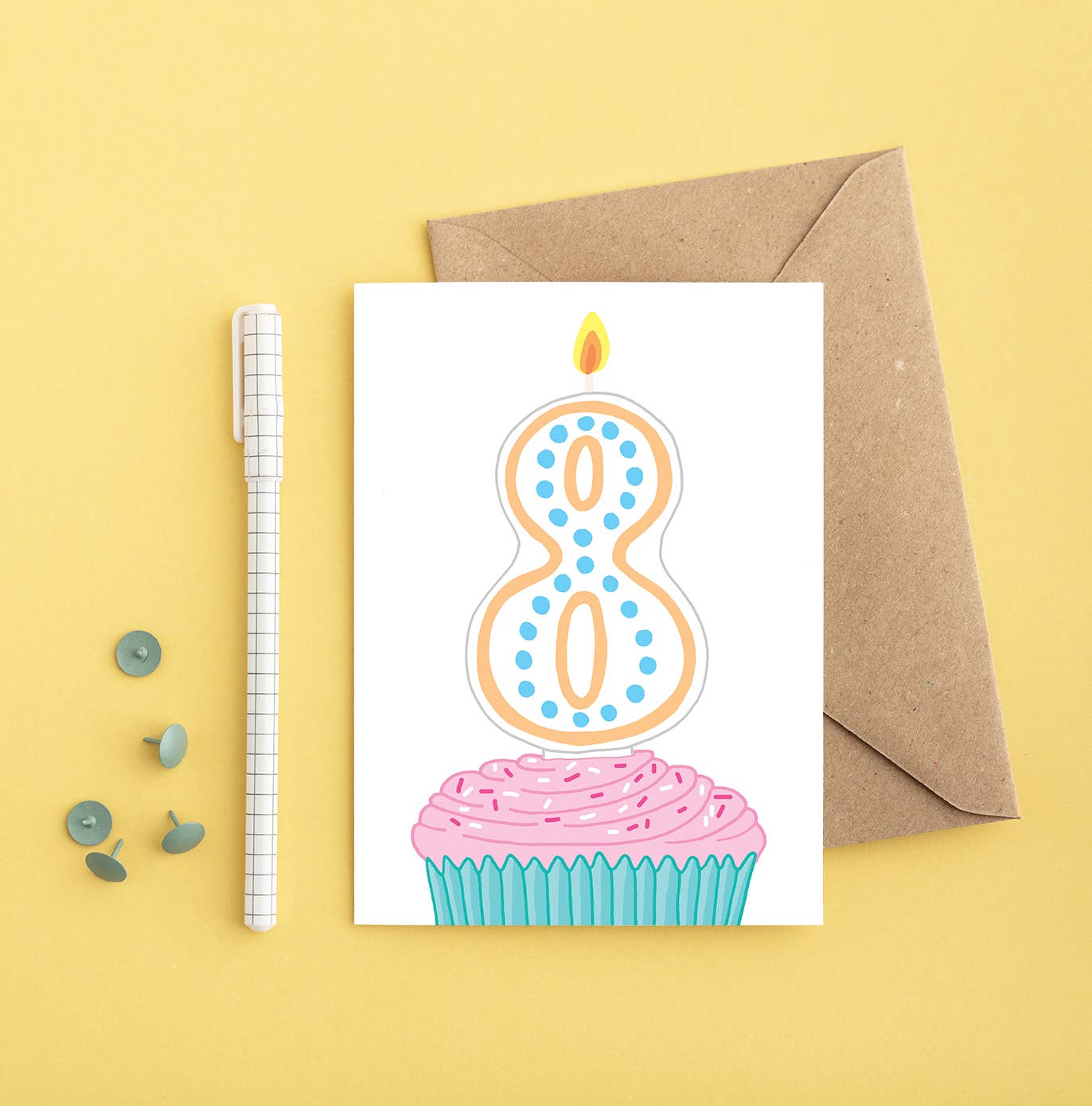 8th Birthday Card with bright cupcake and number 8 candle. Sustainably sourced card, made in the UK.