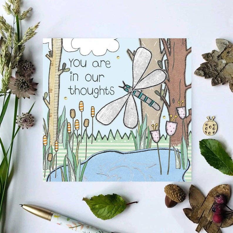 Hand-illustrated 'In Our Thoughts' sympathy greeting card with paper flowers and gems, eco-friendly packaging