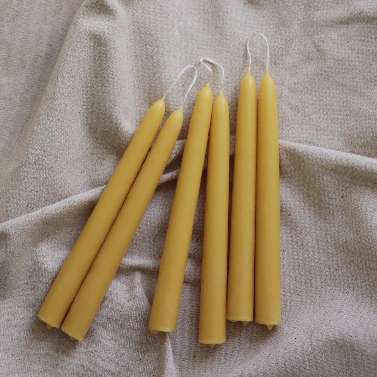 Pair of pure beeswax tapered dinner candles, handmade in the UK, for an eco-friendly ambiance