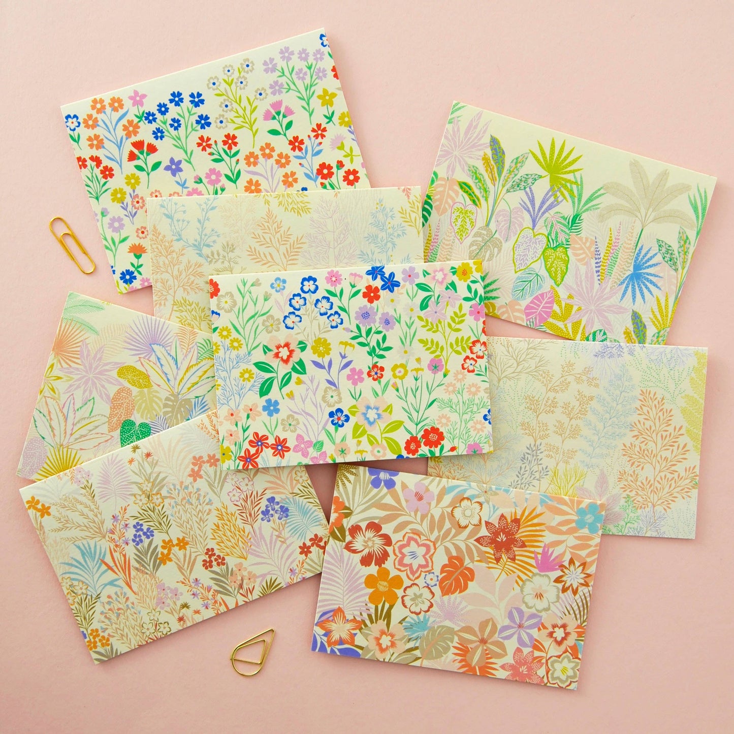 Pack of eight blank botanical notecards with unique floral illustrations, envelopes, and ribbon. Sustainably sourced UK printed cards.