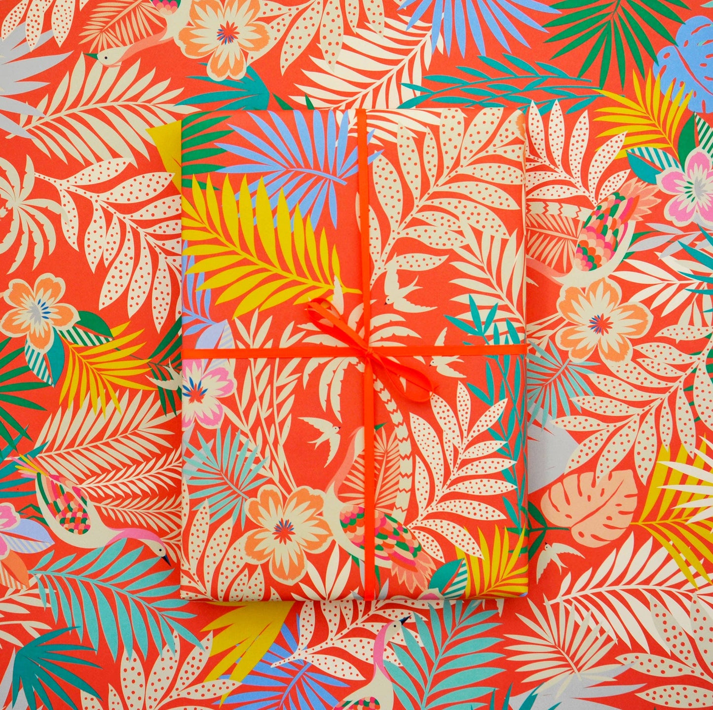 Sheet of Tropicana red tropical print wrapping paper, 50×70 cm, 90 gsm matte finish, fully recyclable."