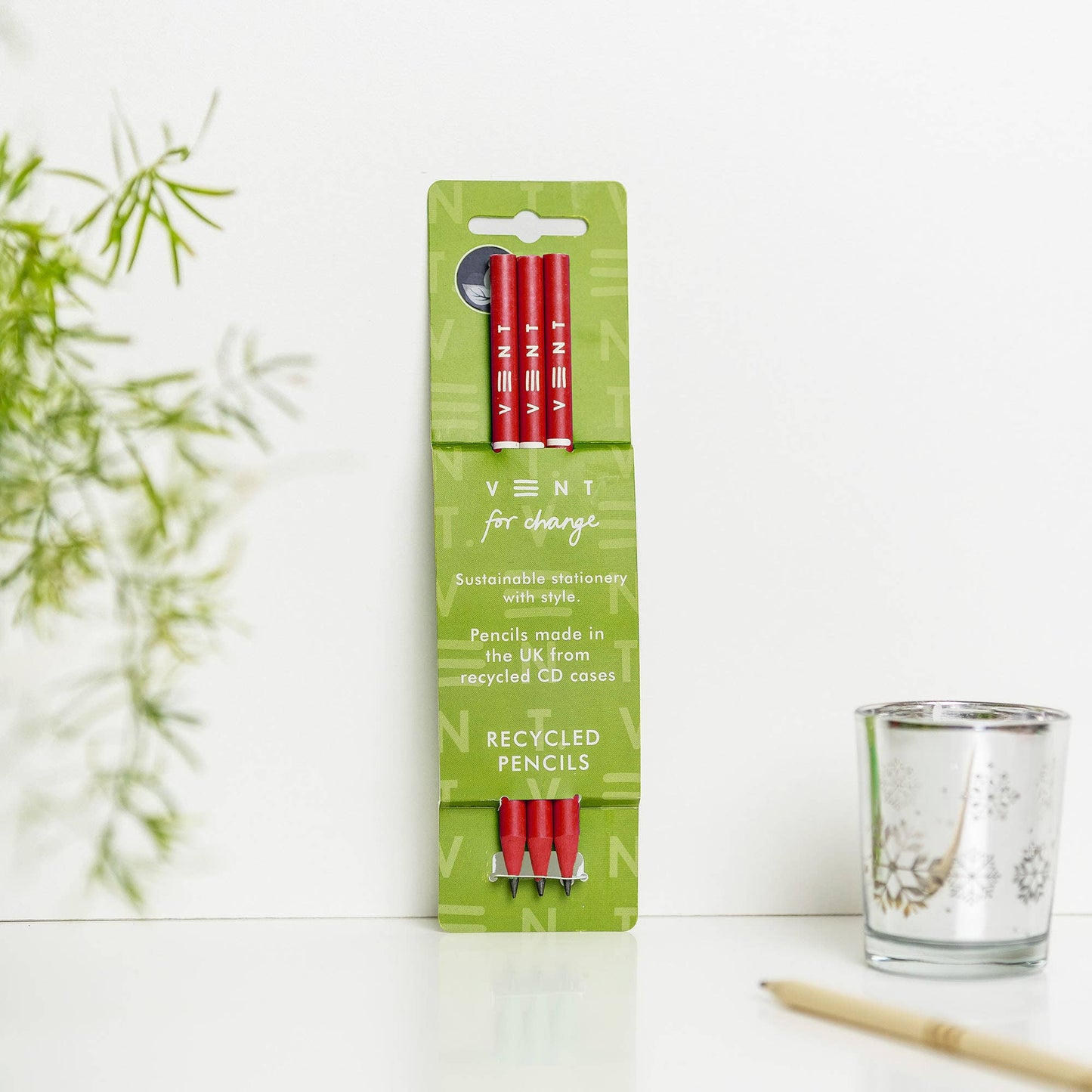 Red pencils made from recycled CD cases with green recycled cardboard packaging