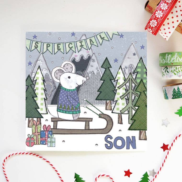 Special Son Christmas Card, eco-friendly, featuring a charming mouse in a Christmas jumper sledging in a snowy forest. Hand-illustrated design.