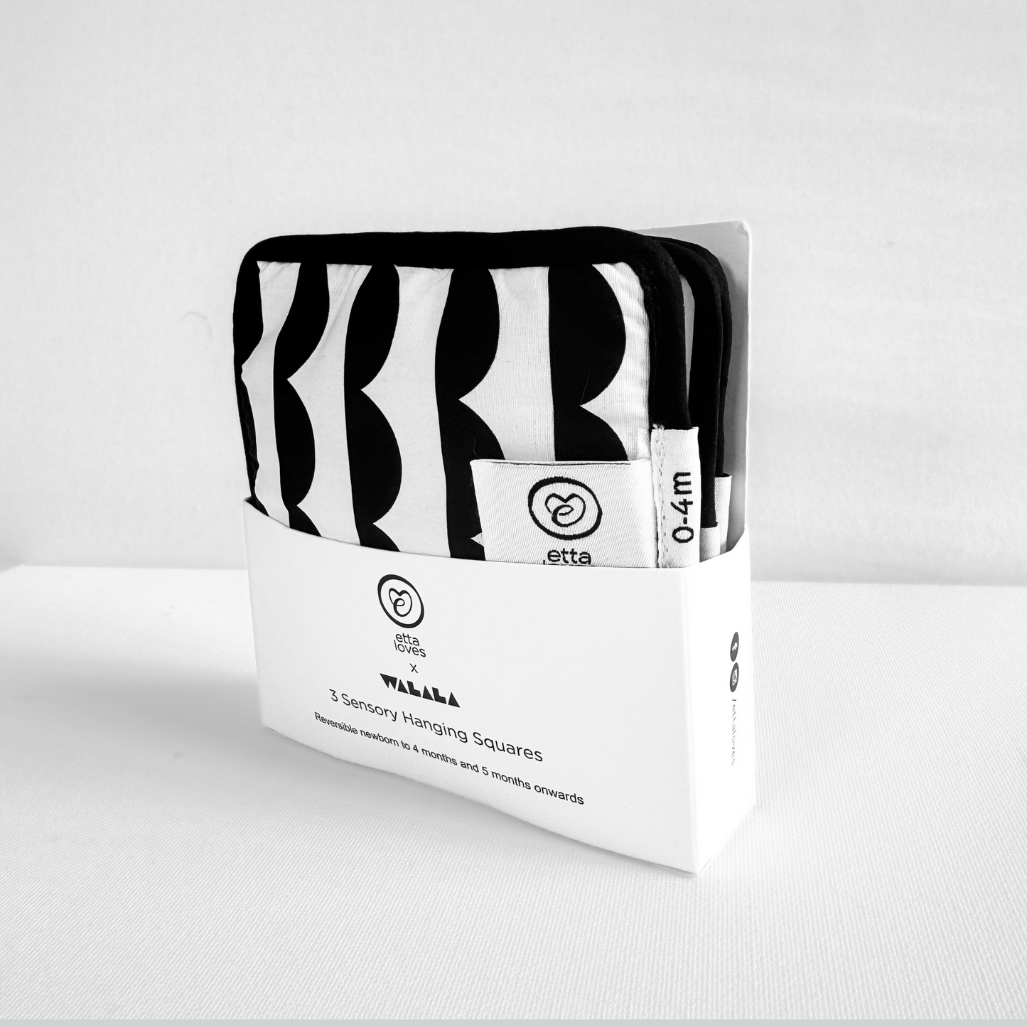 Etta Loves x Walala Sensory Hanging Squares attached to a baby pram for travel