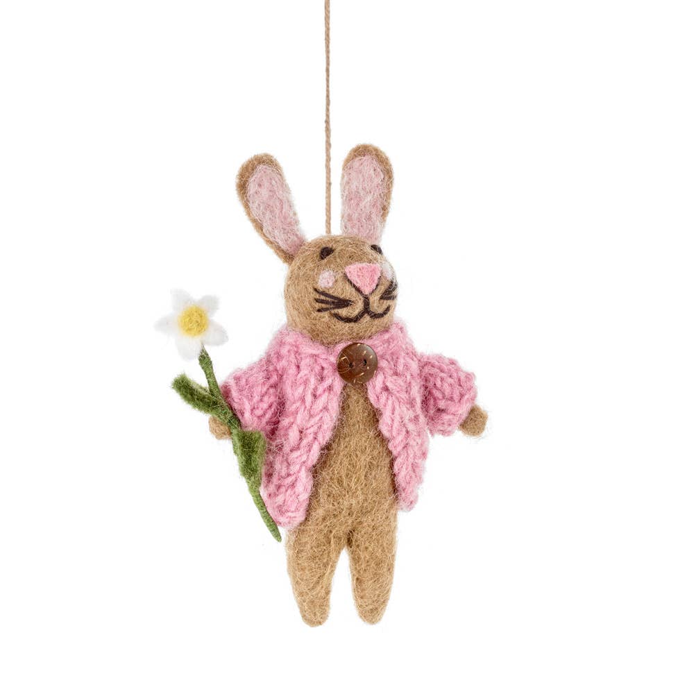 Here to cheer you up whatever the weather by bringing you your own personal daisy - Blossom the bunny's cute look brings the Springtime with her wherever she goes. Her hand kitted pink cardigan has been handstitched to her needle felted body by skilled artisans in Nepal under Fairtrade working conditions.