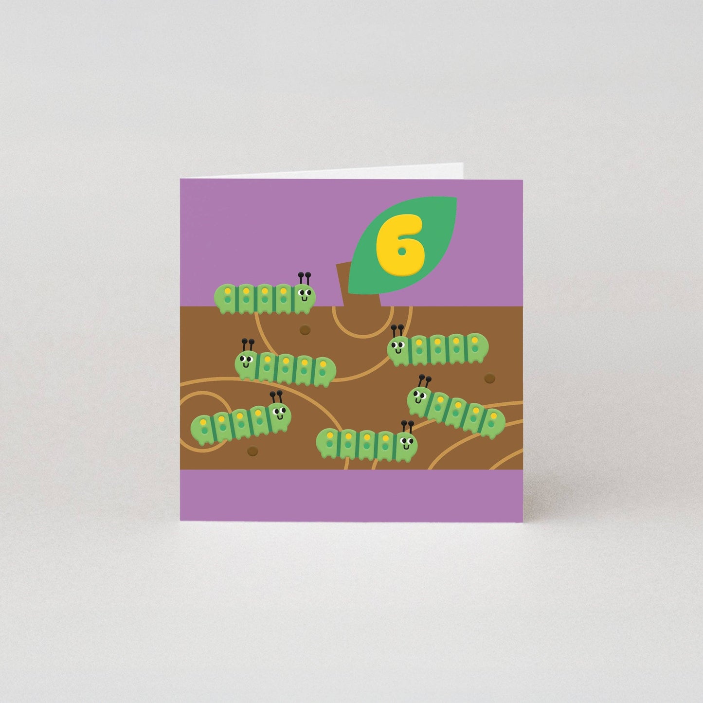 Eco-friendly 6th birthday card featuring six cute caterpillars on a log