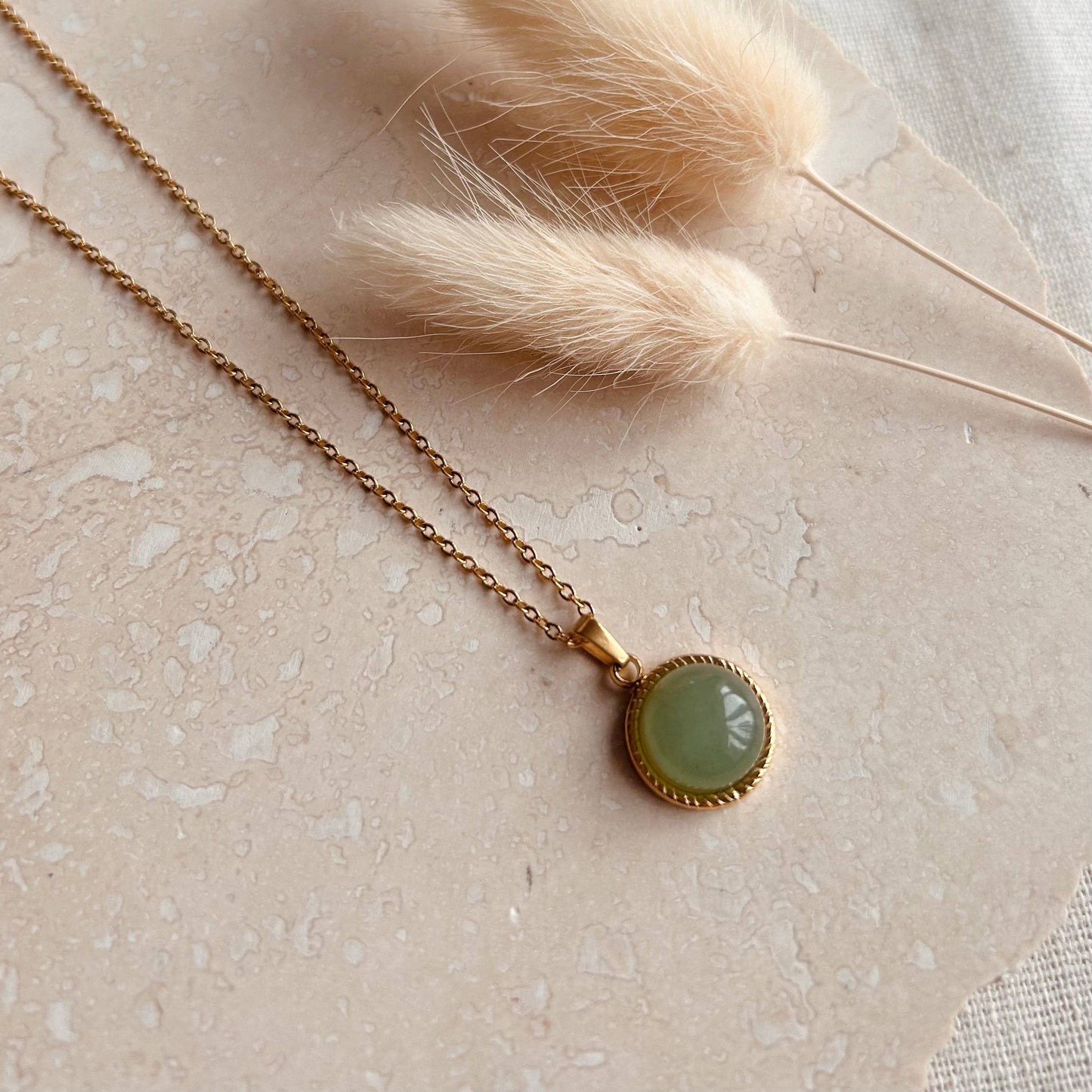 Polished jade circle pendant necklace by Little Nell, water-resistant and hypoallergenic