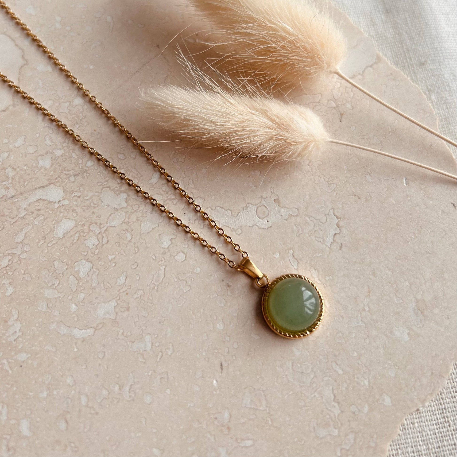 Polished jade circle pendant necklace by Little Nell, water-resistant and hypoallergenic