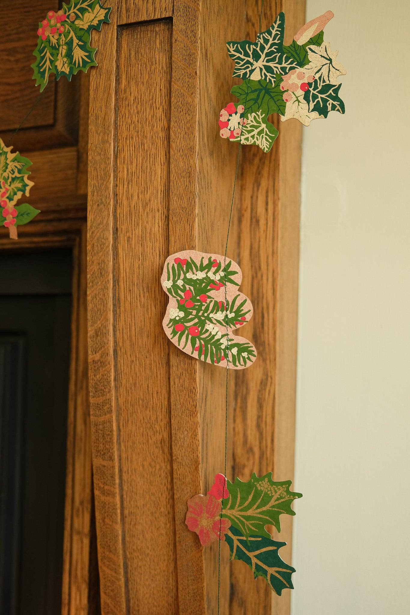 Hand screen printed Holly and Ivy Sewn Garland by East End Press on recycled paper with cotton thread