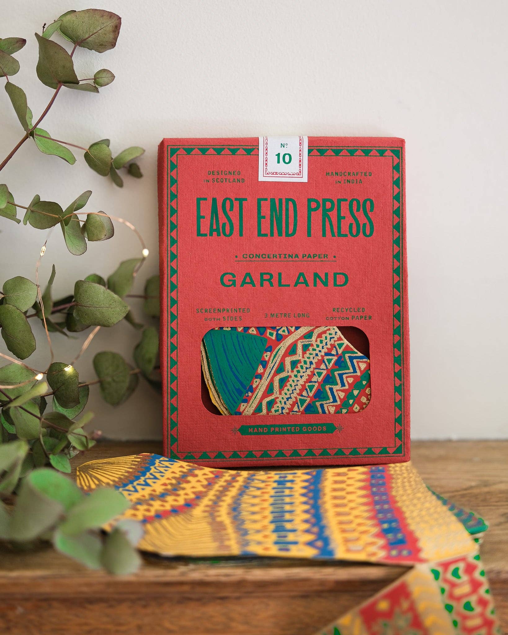 Stockings concertina garland displayed on a festive mantelpiece