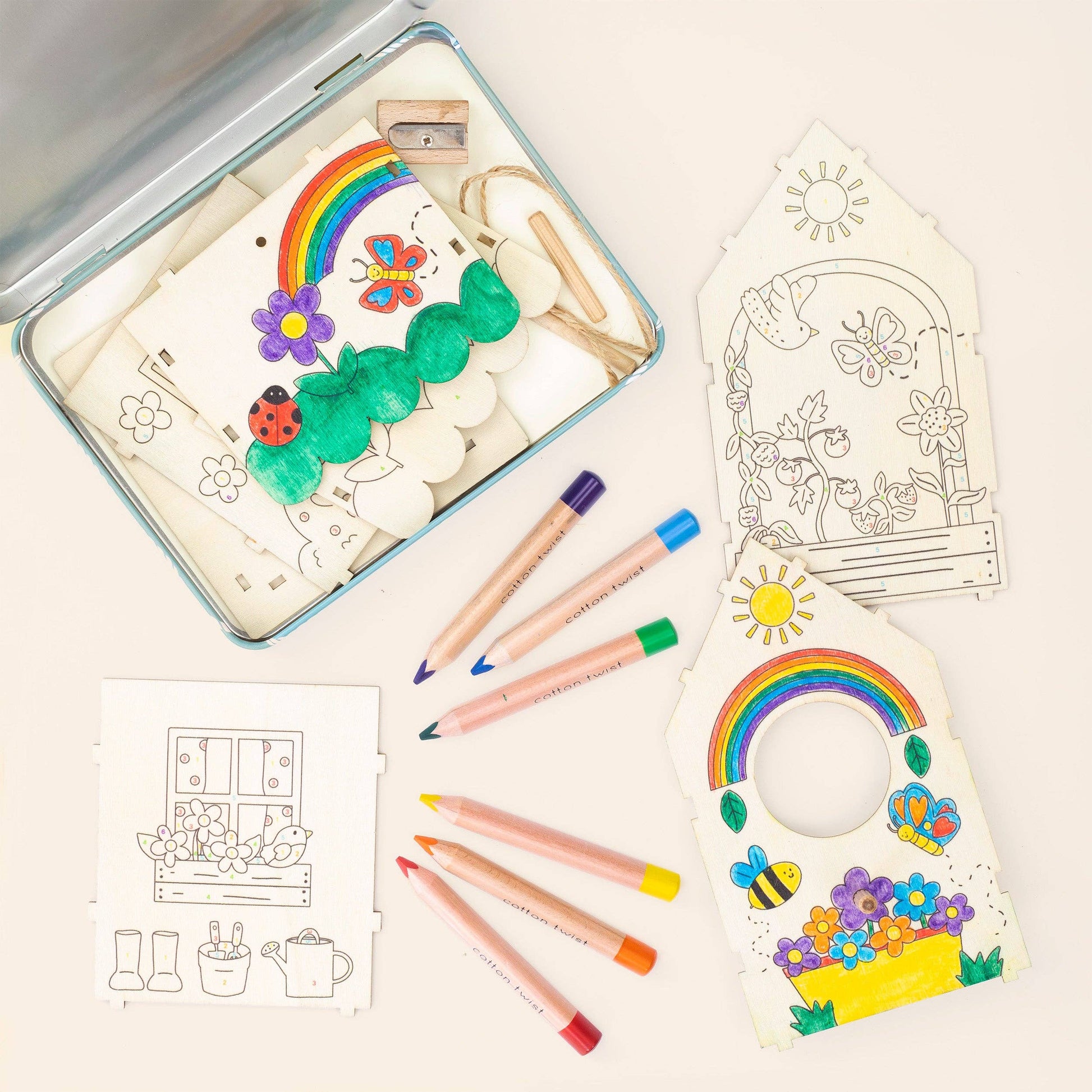 Assembled 3D wooden bird house painted with colourful garden scenes