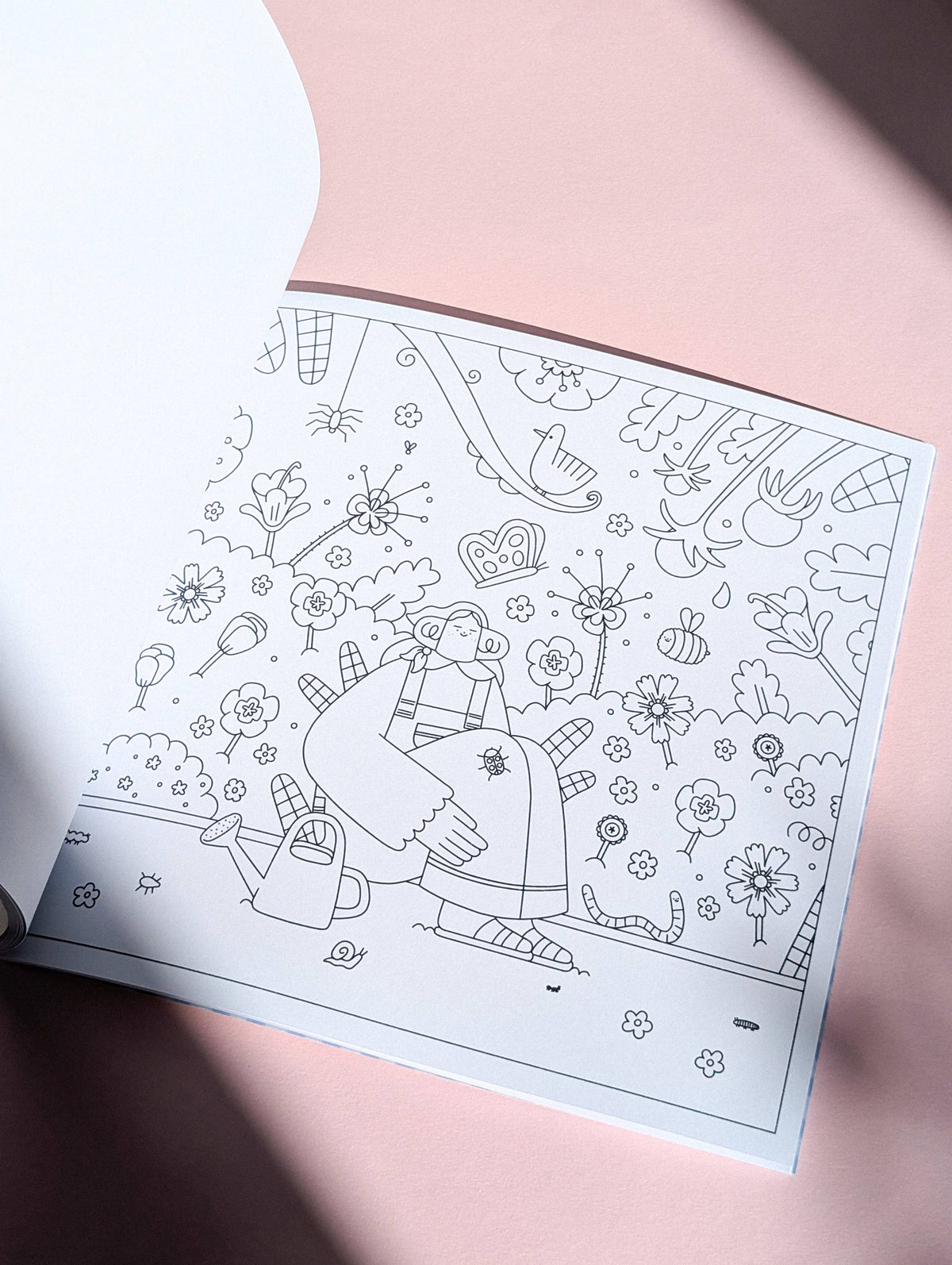 Open page showing a detailed cosy colouring scene
