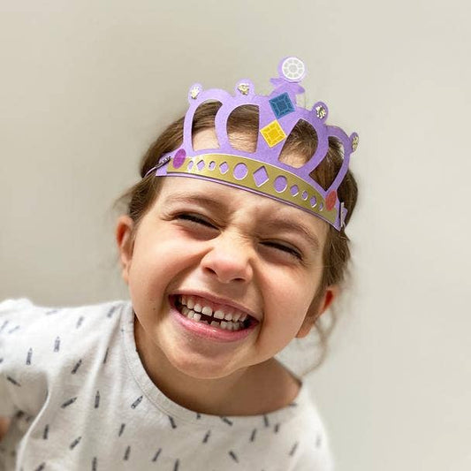 Child wearing a handmade royal crown from the craft kit