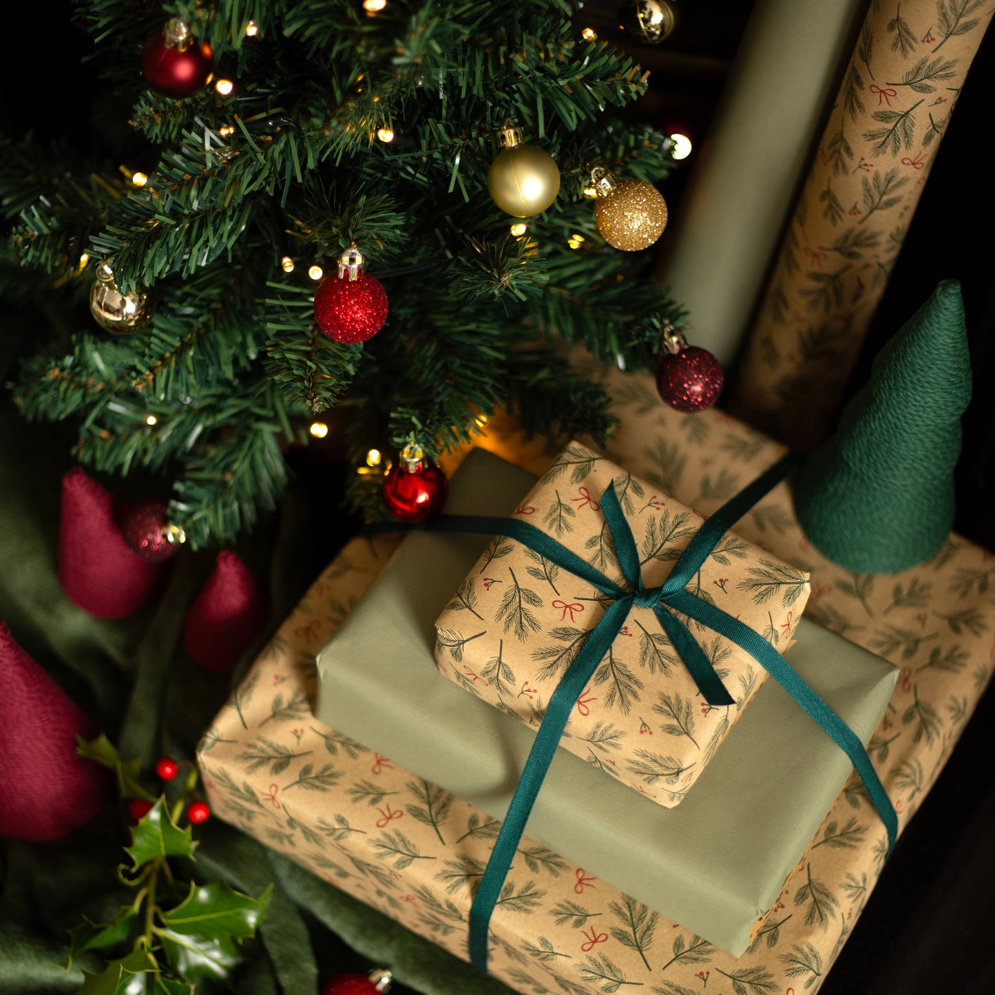 Festive Branches & Bows Christmas Gift Wrap, 5m roll, 500mm wide, 100% recycled brown kraft, eco-friendly sustainable wrapping paper.