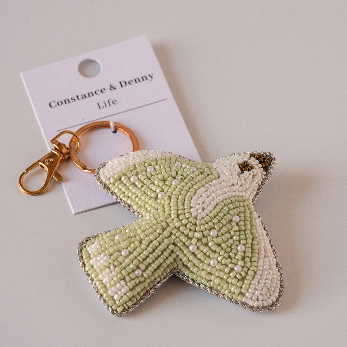 Playful hand-beaded bag charm keyring with brass clasp