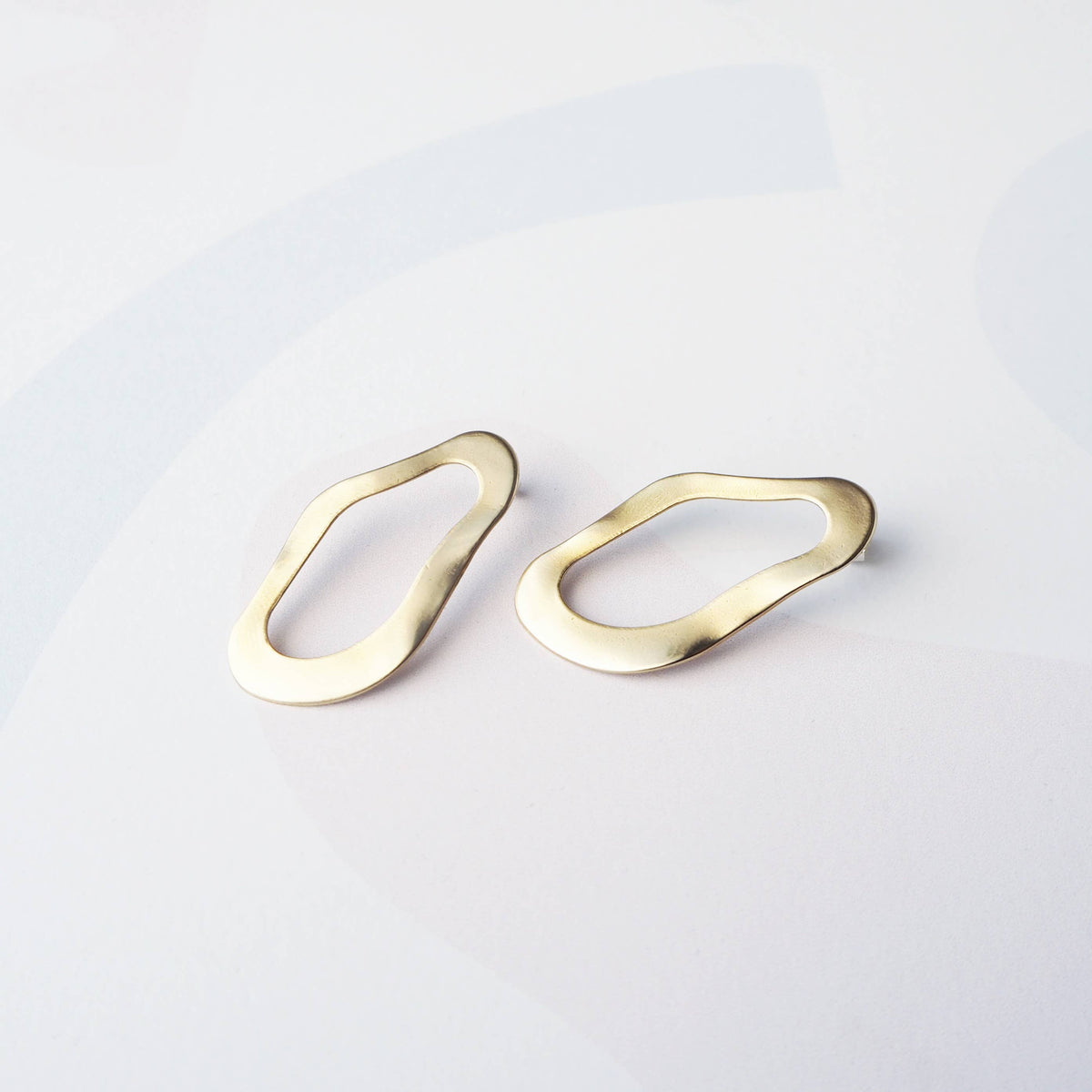 Sterling silver posts on gold statement stud earrings