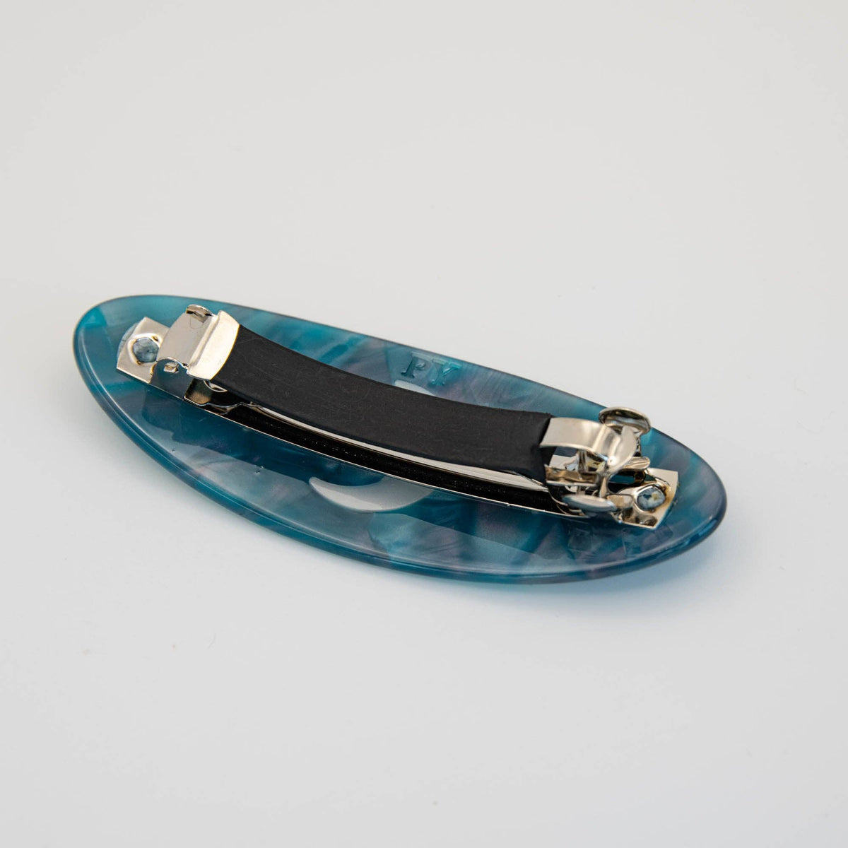 Angled view of marbled Night Sky cellulose acetate hair clip