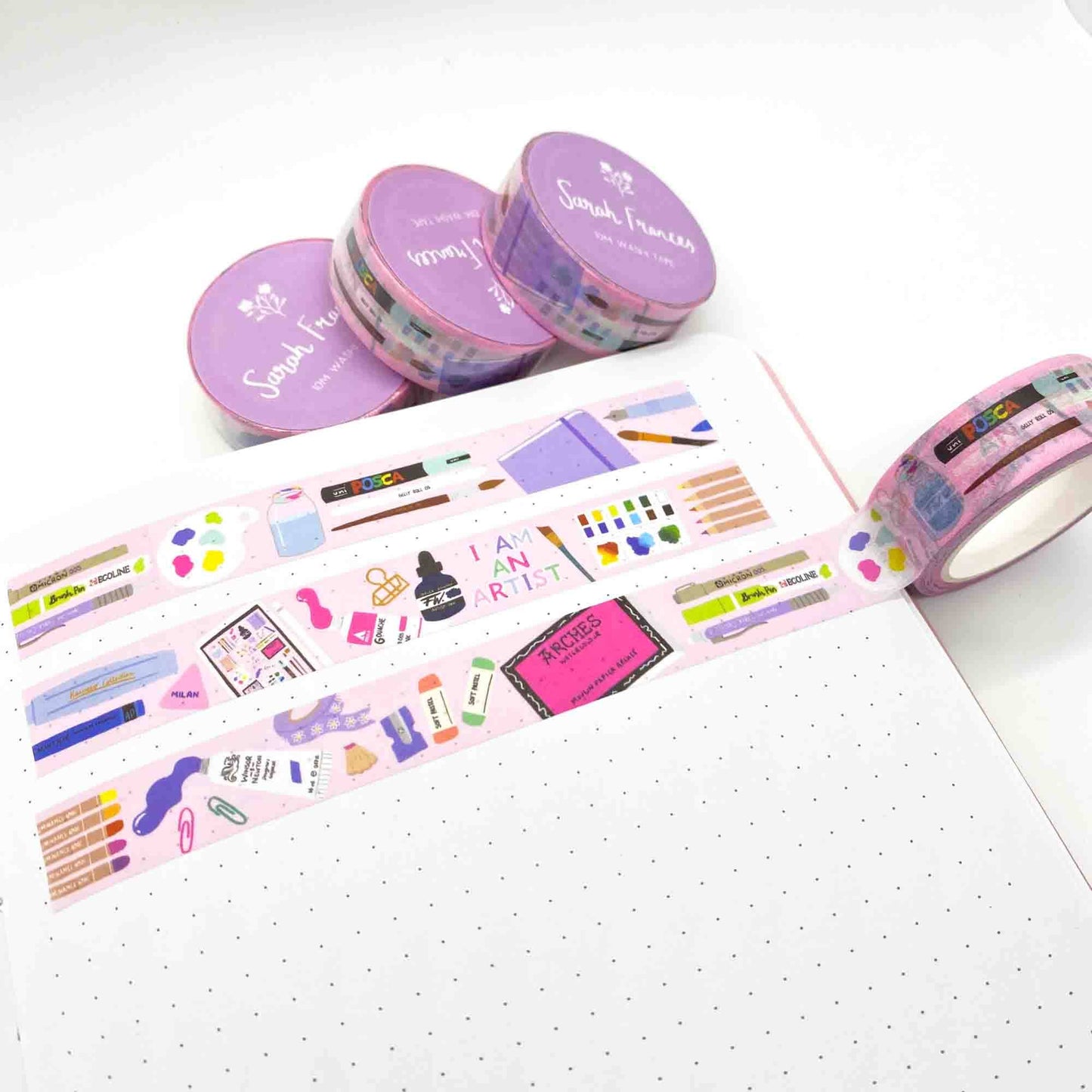 Art Supplies Washi Tape, made in the UK. Pink tape featuring lovely illustrations of painting materials, and stationery. All in bright colours.