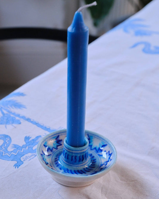 Discover our eco-friendly ceramic candle stick holder, a stunning addition to your sustainable gift collection. Handmade in India, this unique piece showcases a joyful white base adorned with a pale and royal blue pattern, perfect for elevating any dining table or living room decor. By choosing this environmentally responsible present, you support artisans and promote green gifting practices. Brighten your space while making a positive impact—opt for our sustainable gift cards and gifts today!