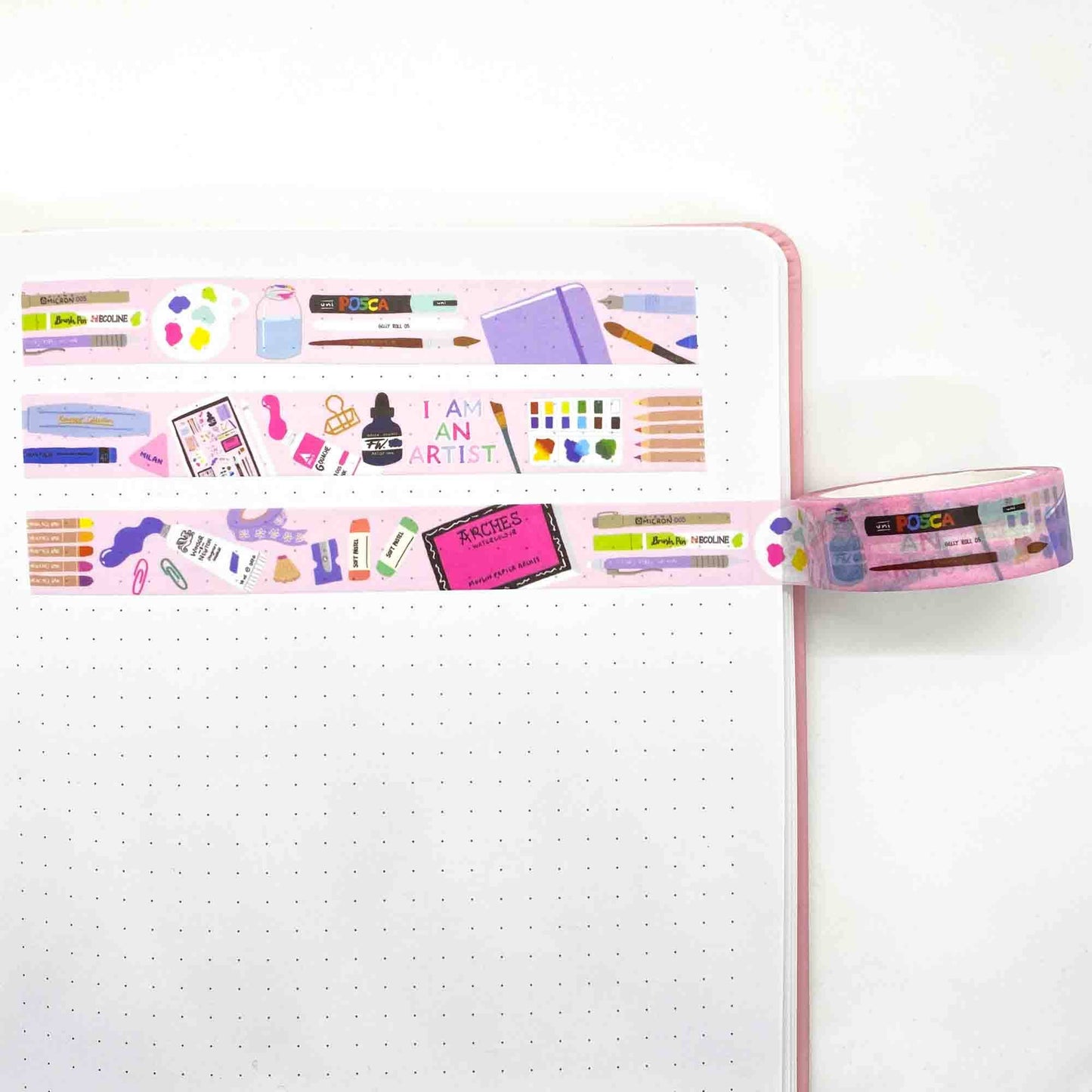 Art Supplies Washi Tape, made in the UK. Pink tape featuring lovely illustrations of painting materials, and stationery. All in bright colours.