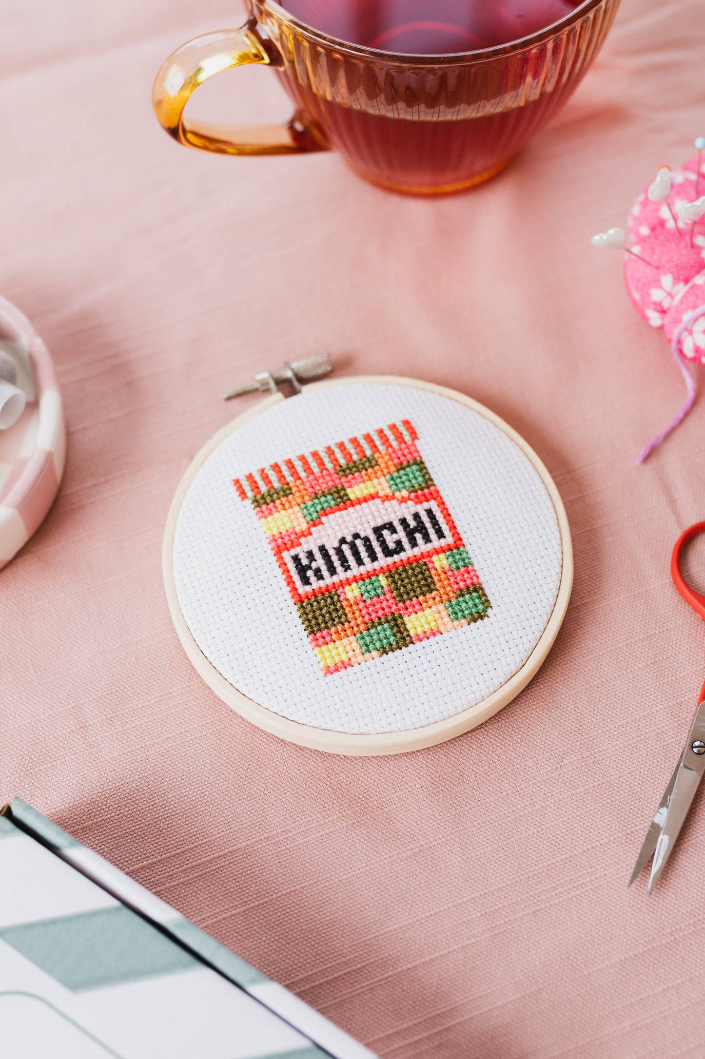 Close-up of the full-colour chart and step-by-step instructions included in the Kimchi Mini Cross Stitch Kit.
