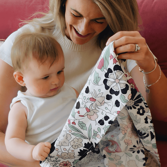Close‑up of Wharfedale Meadow Liberty print showing colourful wildflowers designed for baby visual development from 5 months