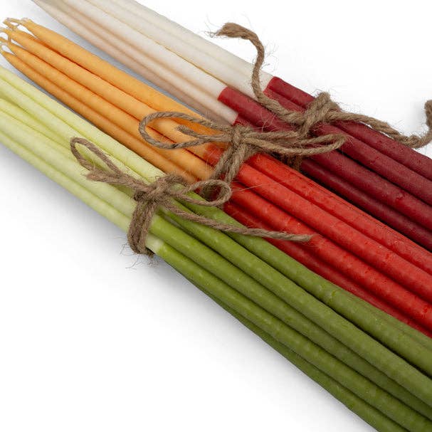 Pack of 12 thin taper candles in saffron and rust