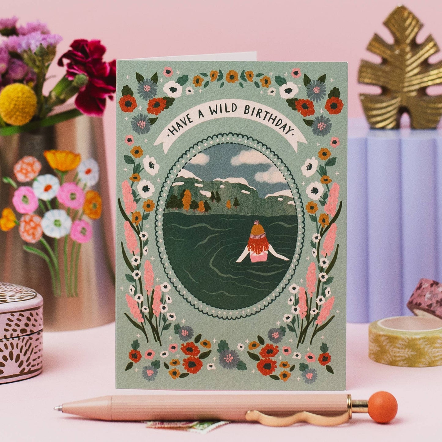 Close up of wild swimmer illustration on birthday card