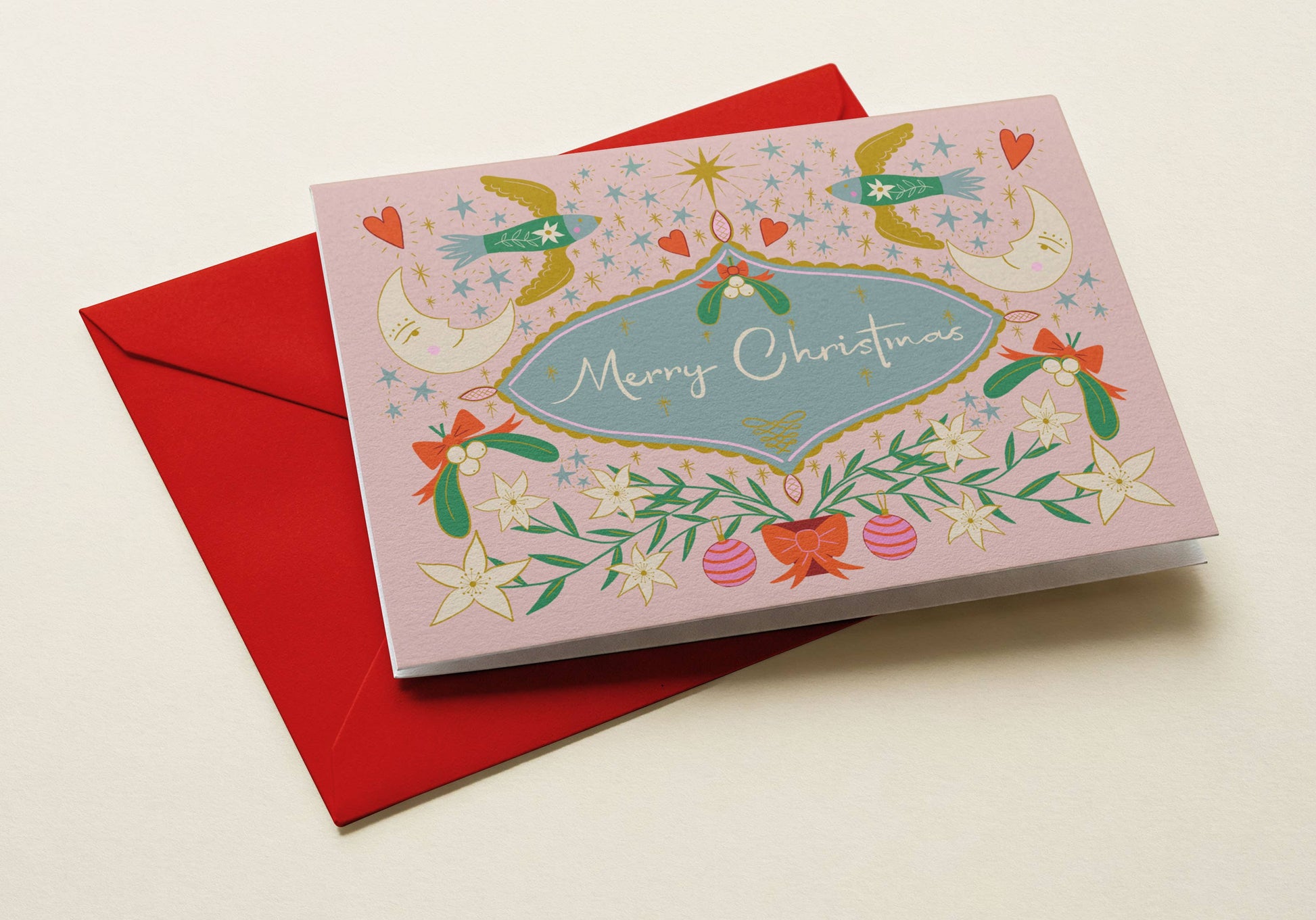Whimsical pastel Christmas card showing stars, birds, and mistletoe