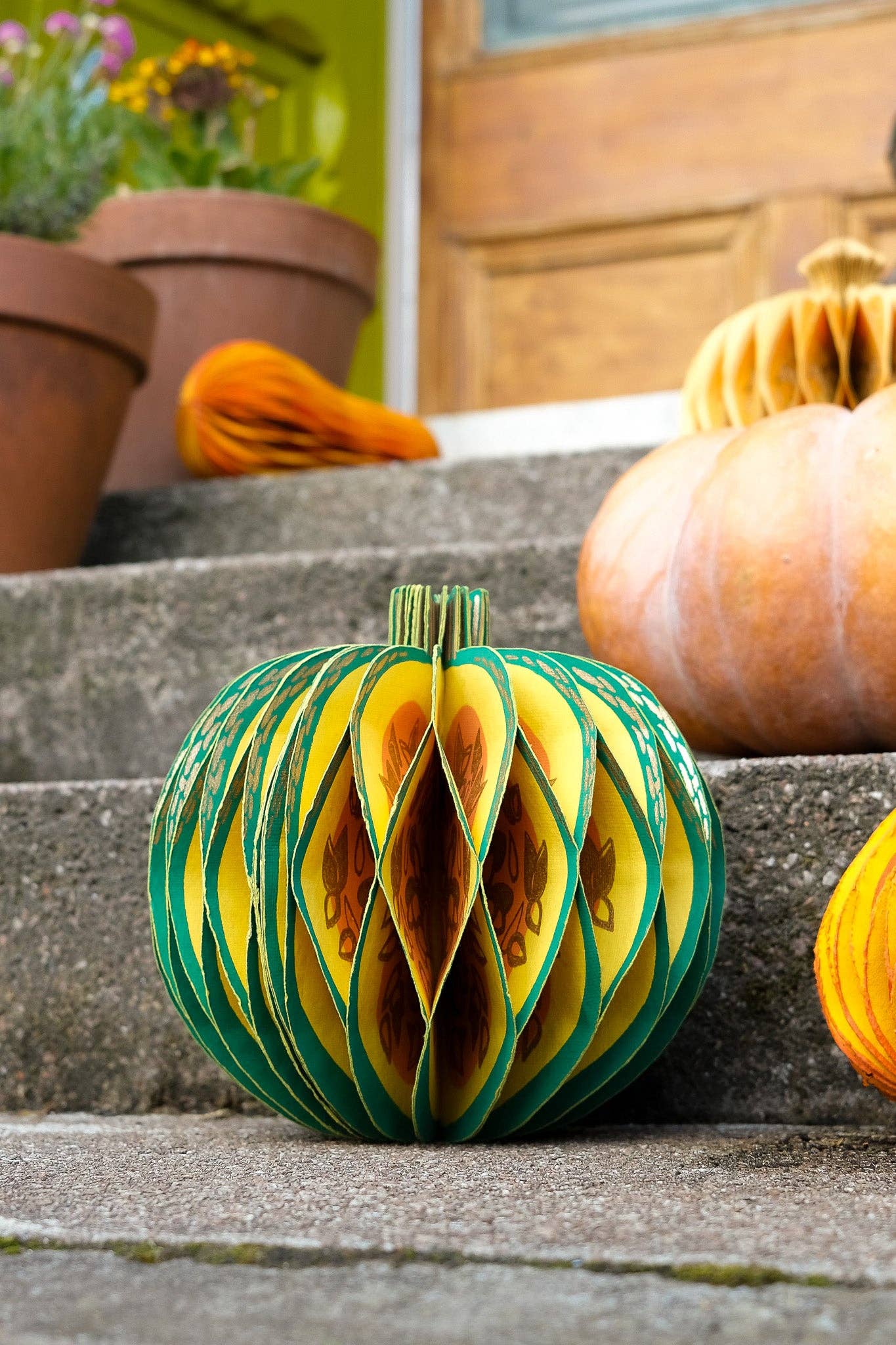 Recycled cotton paper gourd honeycomb decoration with cotton hanging loop, eco-friendly ornament.