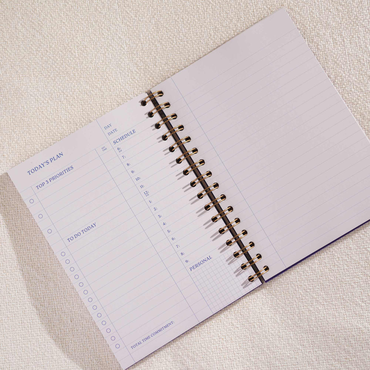 Undated daily schedule page in purple productivity planner