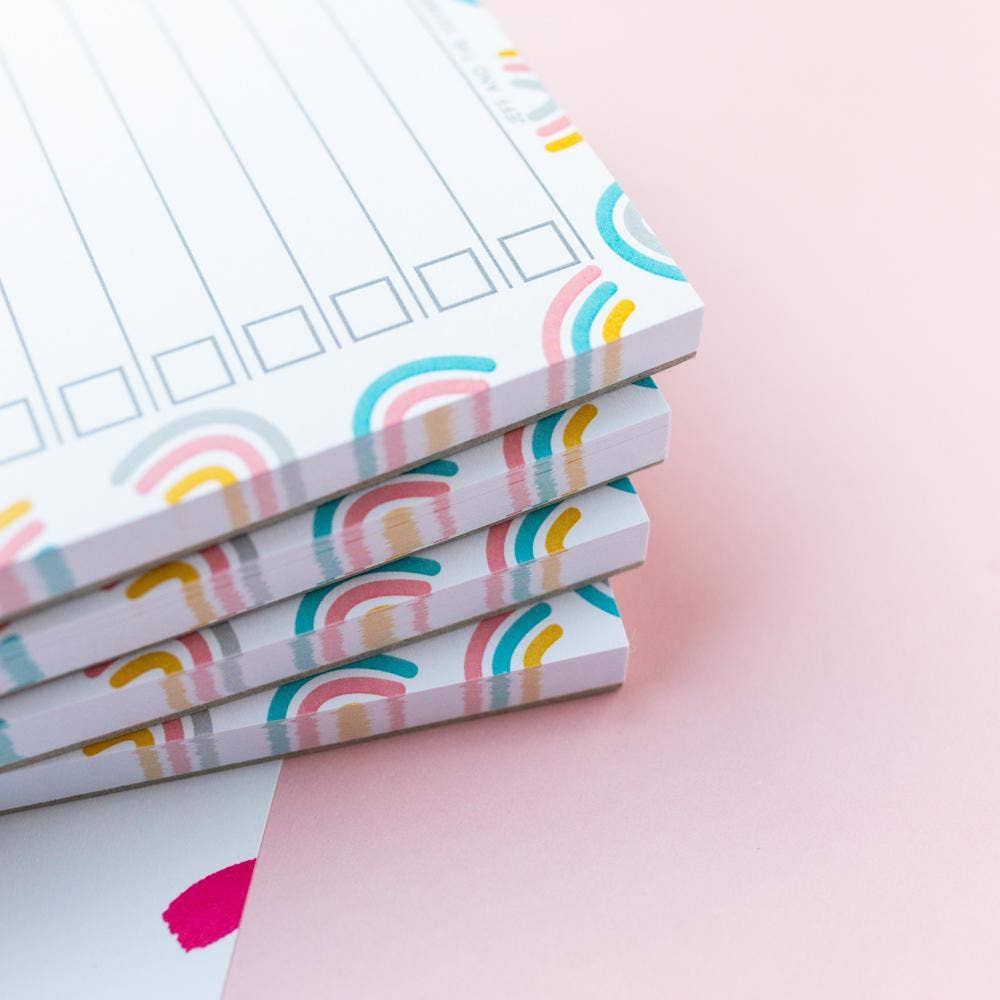Recycled A6 notepad with rainbow design showing tear-off sheets