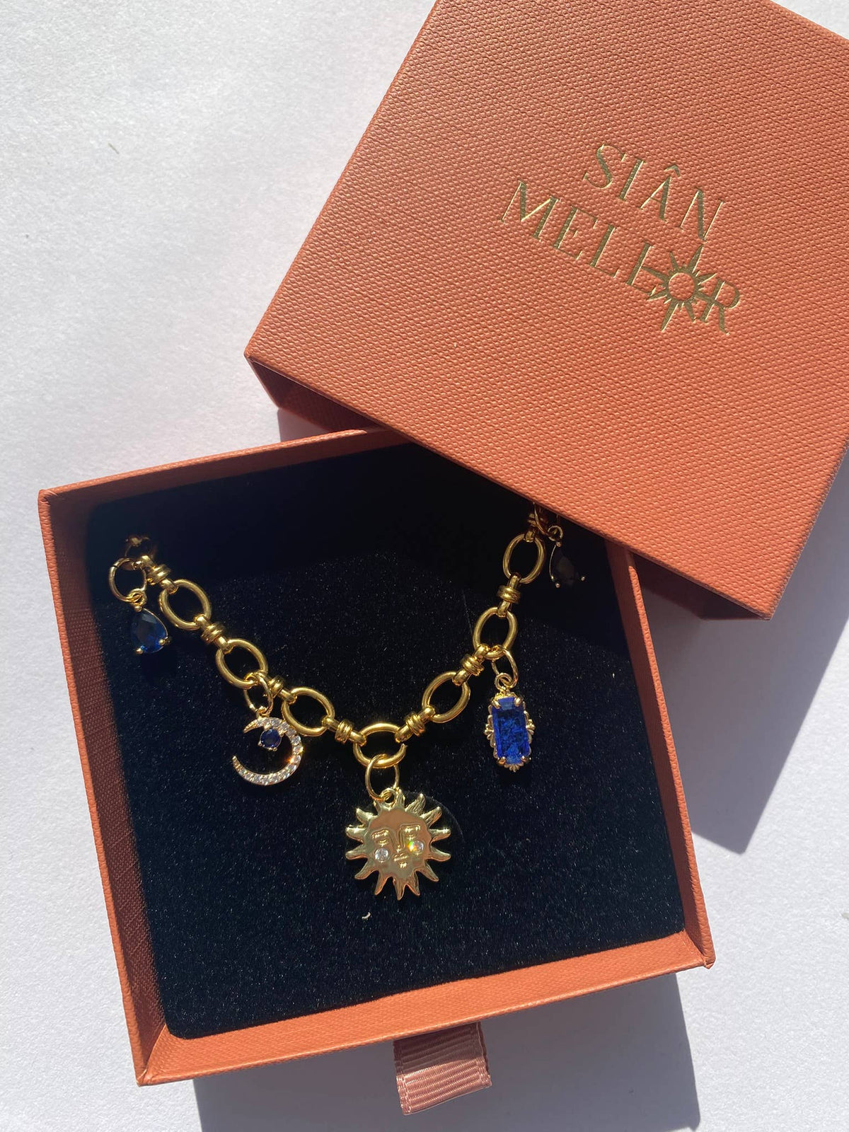 Celestial multi charm gold necklace on a chunky chain
