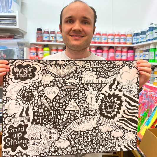 Close-up of Arthouse Unlimited 'Be Happy' chocolate bar showing pistachio crumb texture.