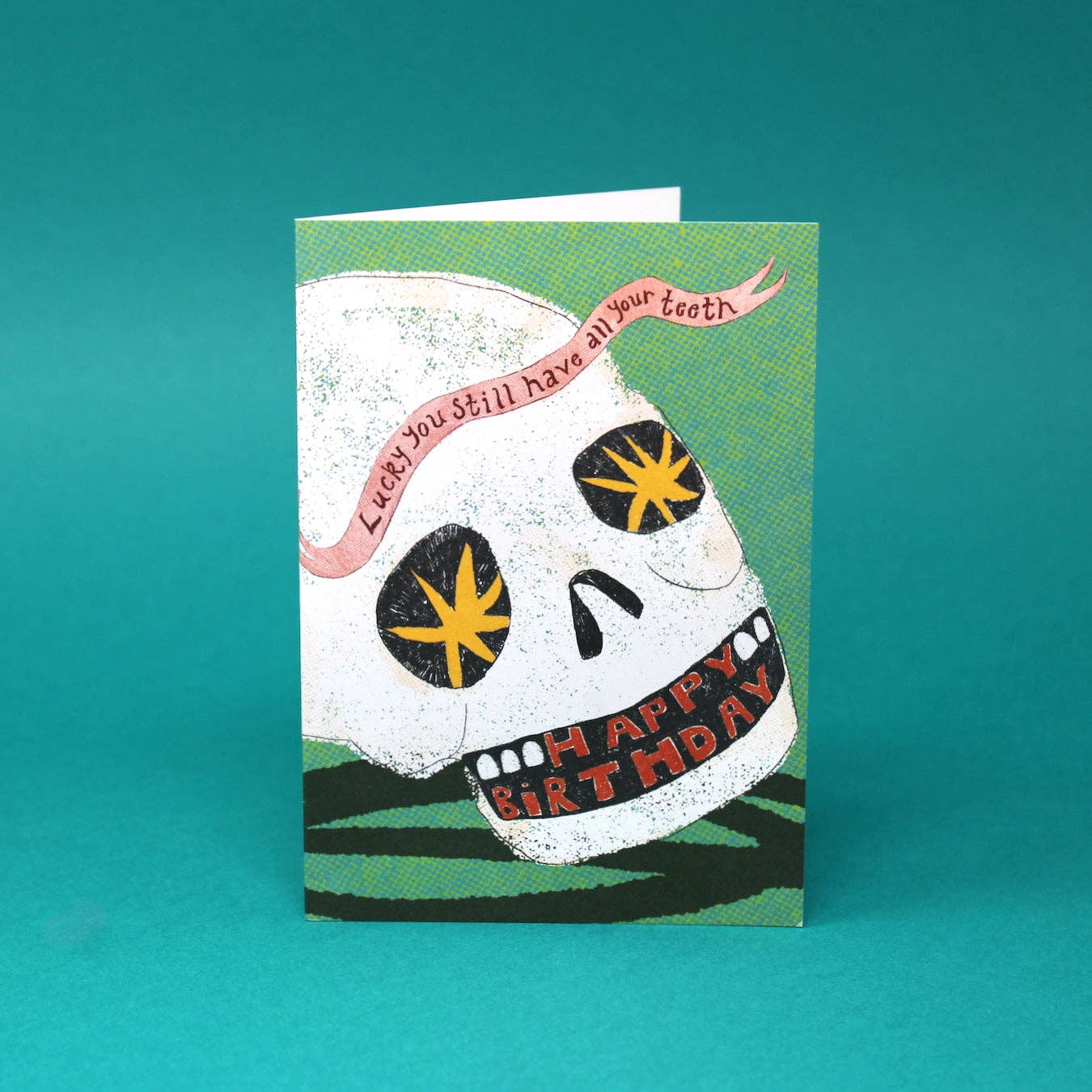 Close up of funny birthday card illustration printed with vegan inks