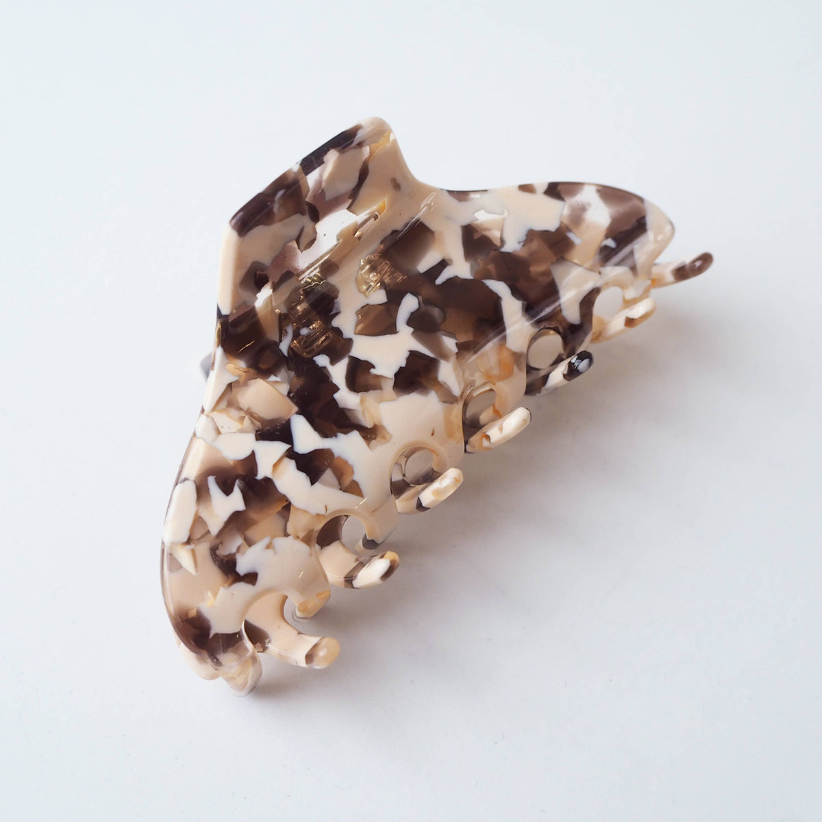 Missy hair claw in conch shell design on sustainable packaging