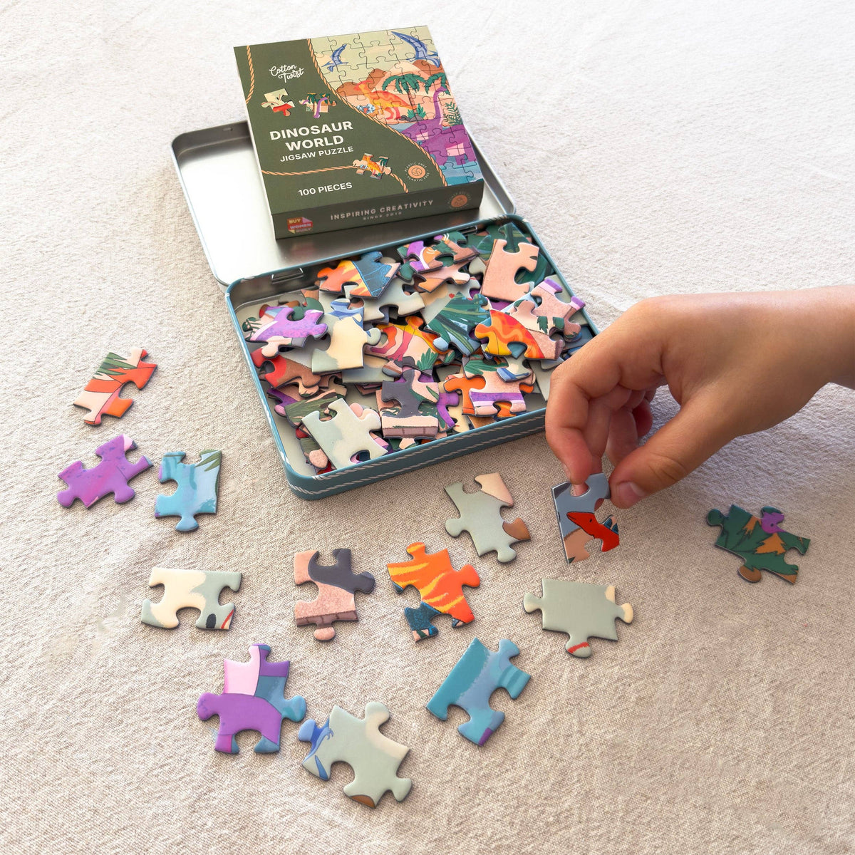Completed 100 piece dinosaur world puzzle for kids