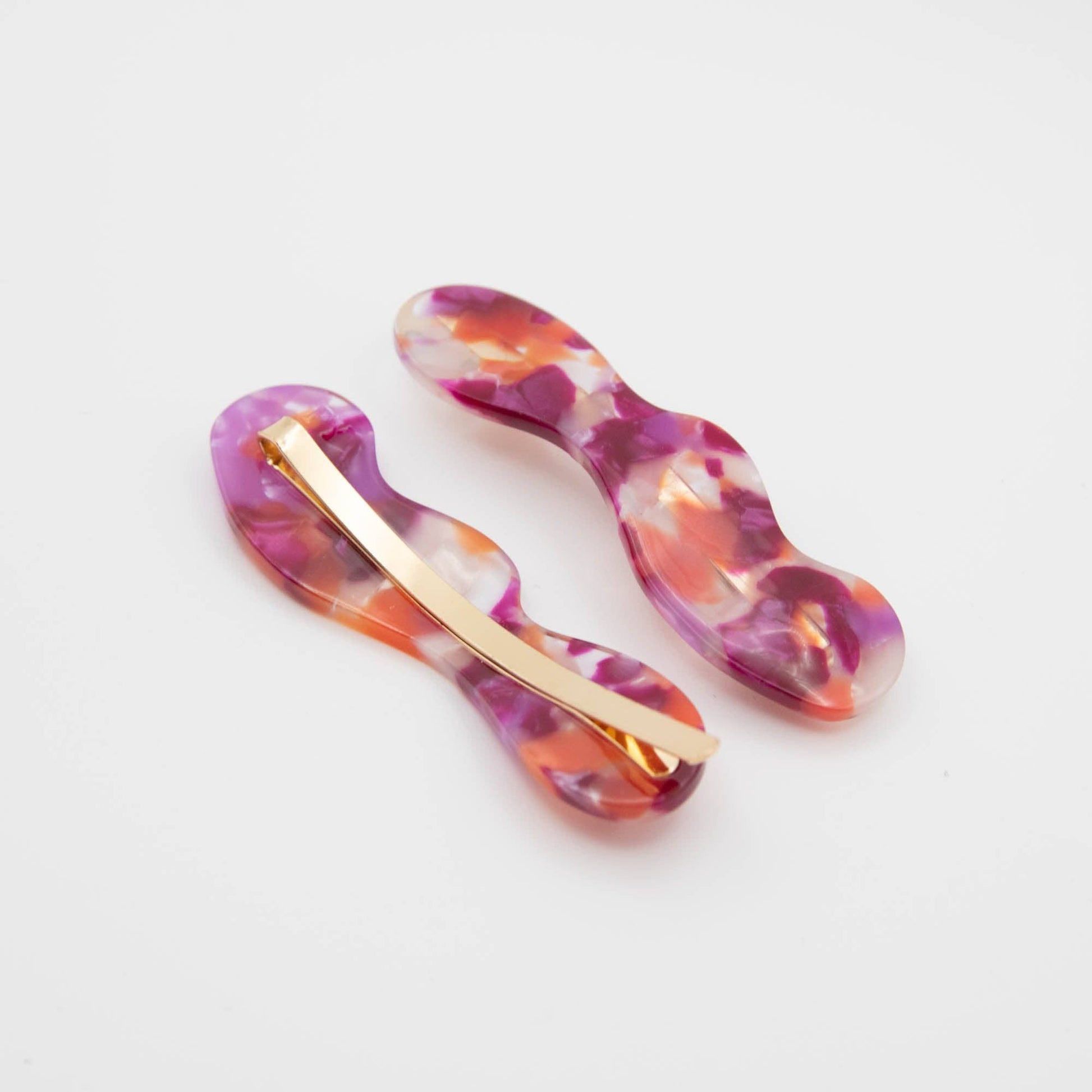 Lifestyle shot of berry hair slides and jewellery