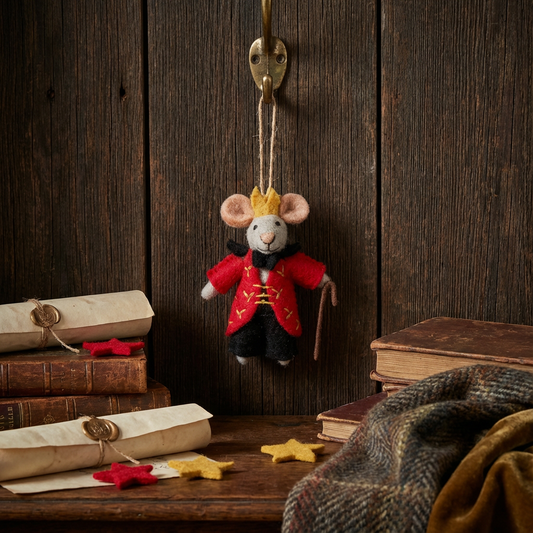 Close up of needle felted Mouse King wearing royal crown and red outfit