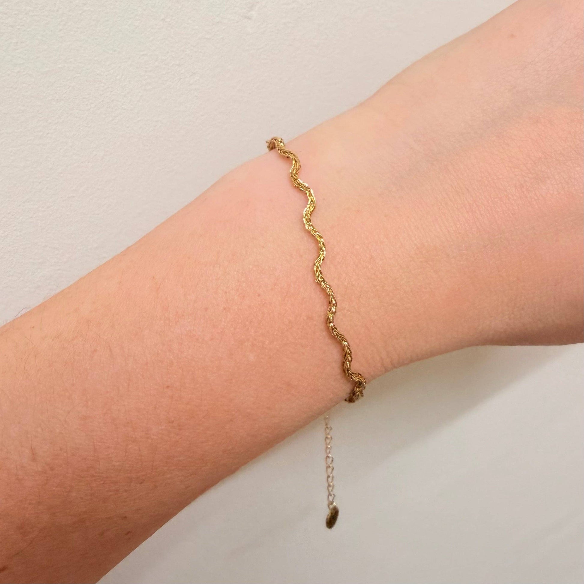Close up of Gold Wavy Bracelet showing extender chain