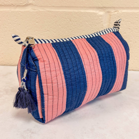 Pink and navy wide stripe cosmetic bag showing curved box shape
