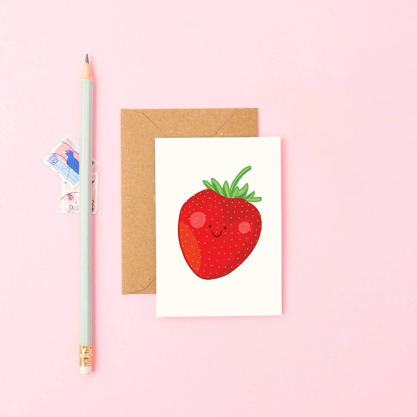 Hand-drawn mini strawberry greeting card—smiling fruit design, A7 size, sustainable UK card with Kraft envelope.